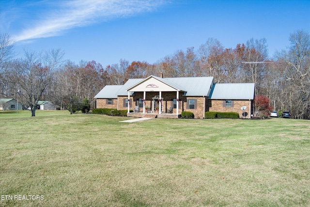 view of front of house featuring a front yard and covered porch