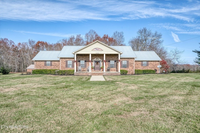 view of front of home with covered porch and a front yard