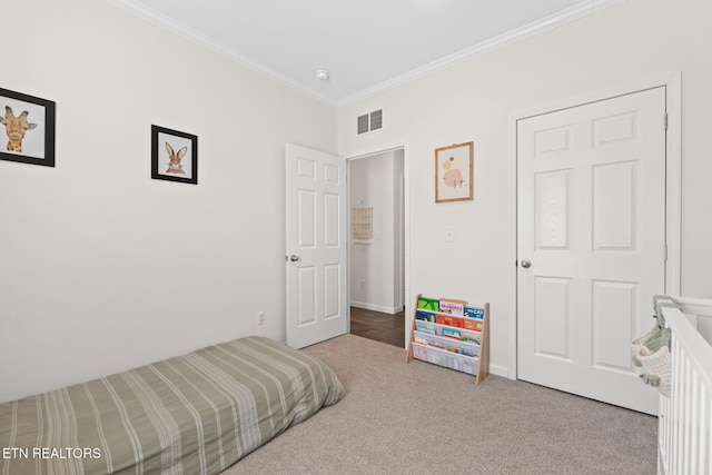 bedroom featuring light colored carpet and ornamental molding