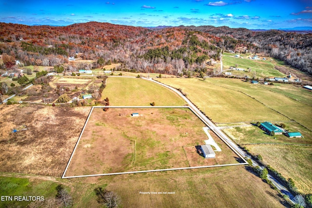 aerial view featuring a mountain view and a rural view