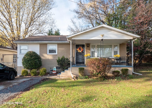 view of front of property with a porch and a front yard