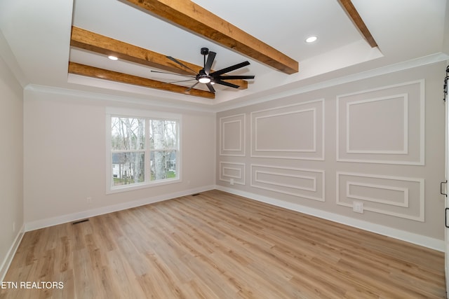 unfurnished room with beam ceiling, light wood-style flooring, a ceiling fan, and baseboards