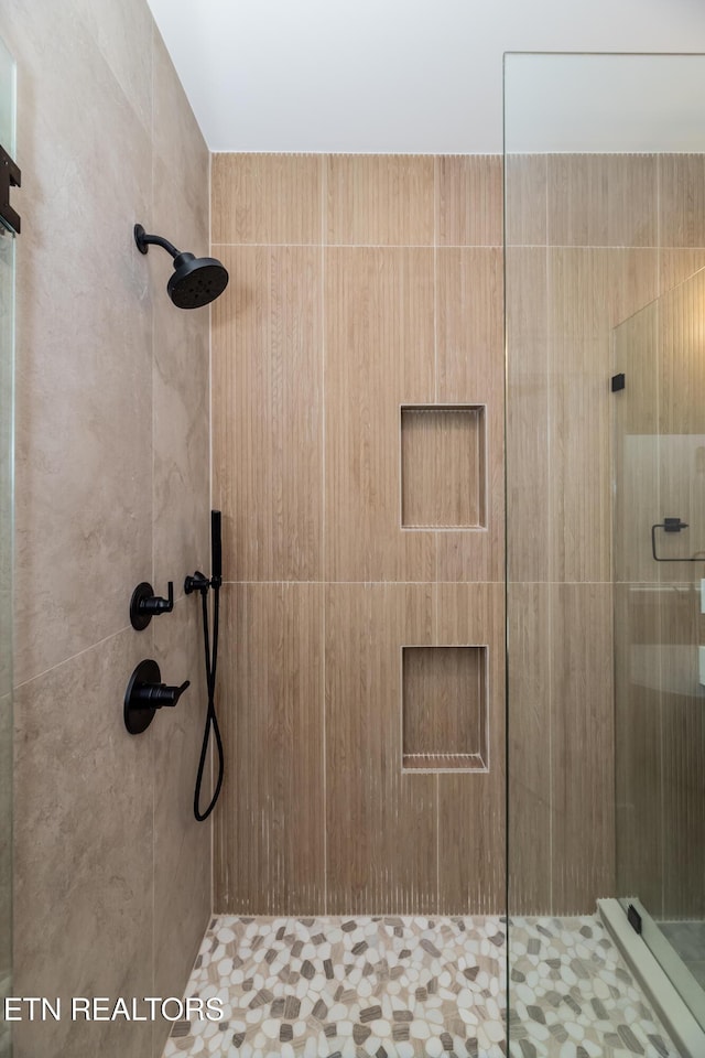 bathroom featuring a shower stall