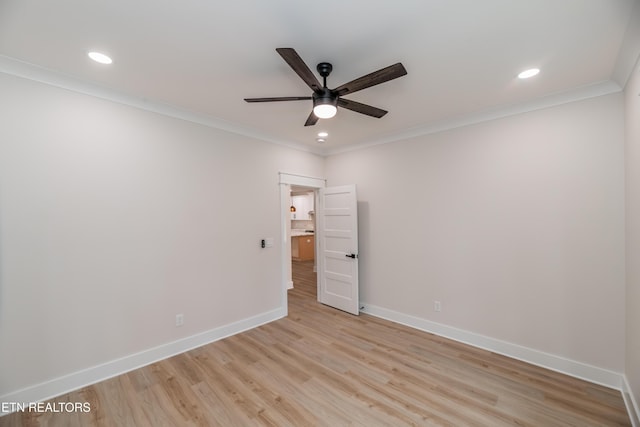 spare room featuring a ceiling fan, baseboards, recessed lighting, ornamental molding, and light wood-type flooring