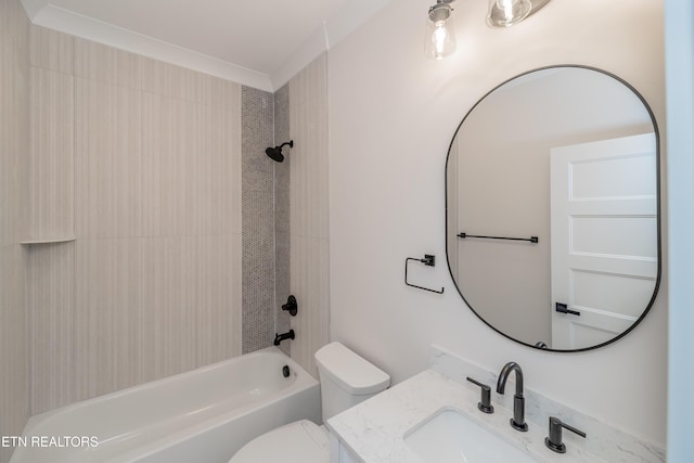 bathroom featuring bathtub / shower combination, toilet, and vanity