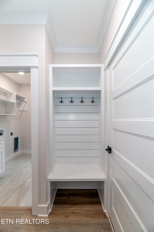 mudroom with baseboards and light wood finished floors