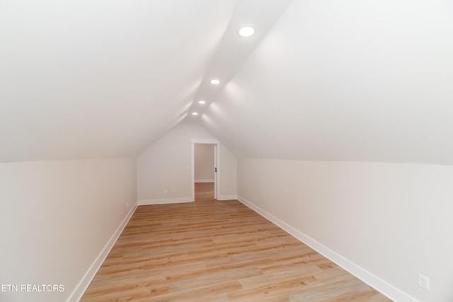 bonus room featuring recessed lighting, baseboards, lofted ceiling, and light wood finished floors