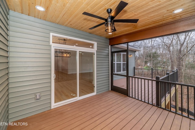 wooden deck featuring a ceiling fan