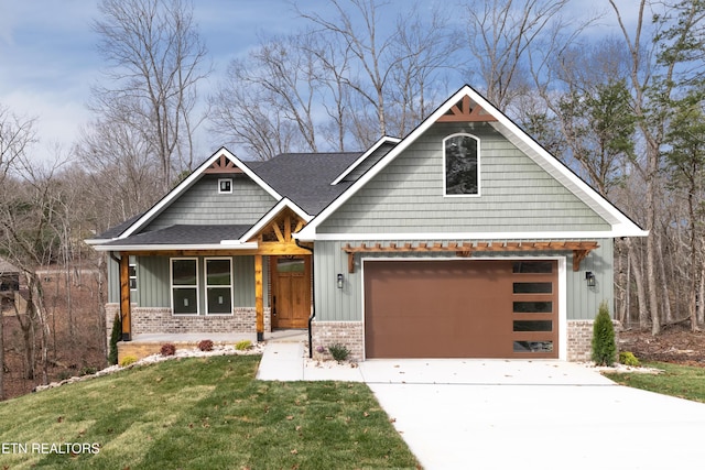 craftsman-style house featuring brick siding, board and batten siding, driveway, and a front yard