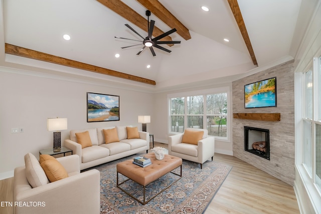 living room with light wood finished floors, ceiling fan, lofted ceiling with beams, recessed lighting, and a fireplace