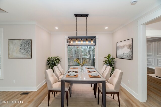 dining area with ornamental molding, recessed lighting, baseboards, and light wood-type flooring