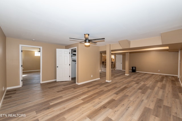 unfurnished living room featuring wood-type flooring and ceiling fan