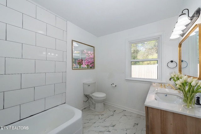 bathroom with a bathtub, toilet, and vanity