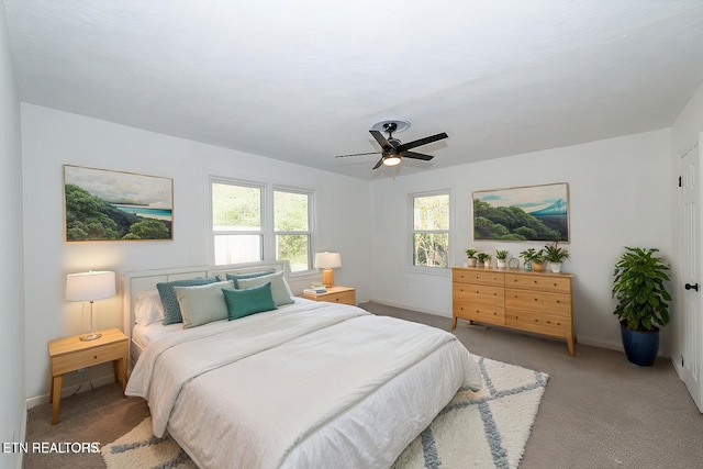 bedroom with ceiling fan and carpet flooring