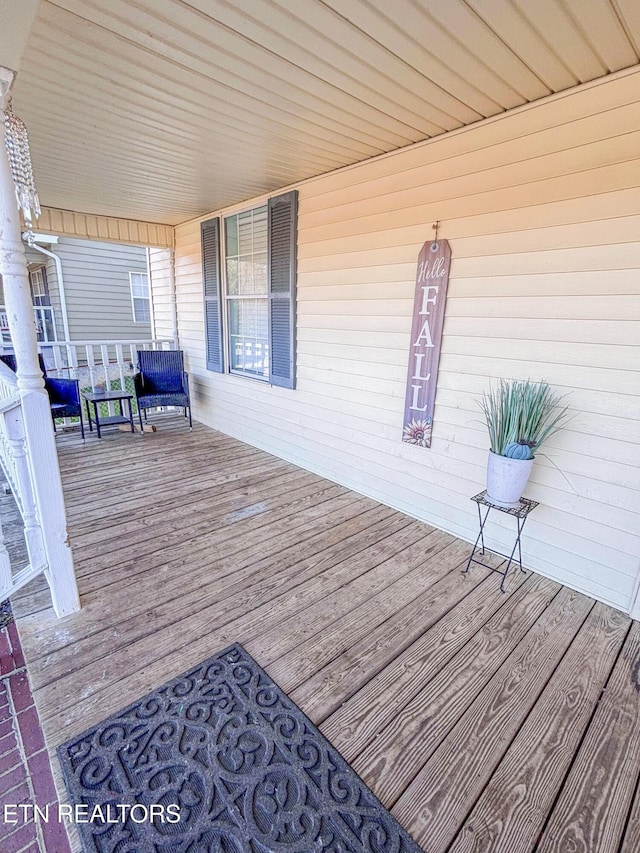 deck featuring covered porch