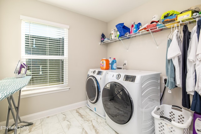 laundry room with washer and dryer