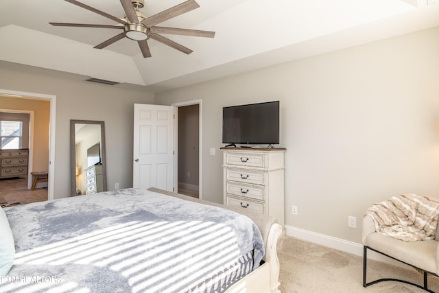 bedroom featuring ceiling fan, light carpet, and vaulted ceiling