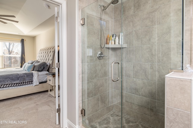 bathroom with ceiling fan, a shower with door, and vaulted ceiling