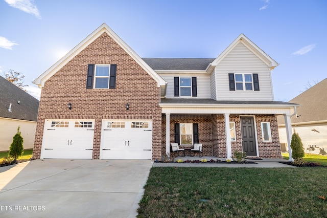 front of property with a front yard, a porch, and a garage