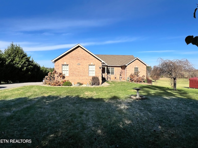 view of front of house with a front lawn