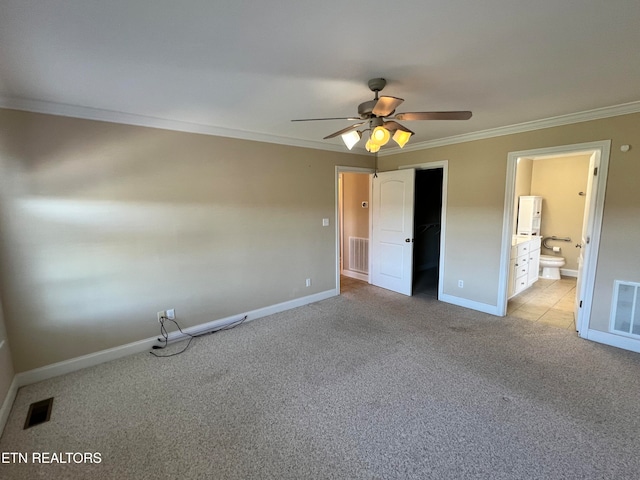 unfurnished bedroom featuring connected bathroom, ceiling fan, crown molding, light colored carpet, and a closet