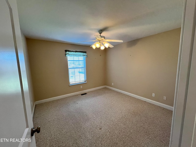 carpeted empty room with ceiling fan