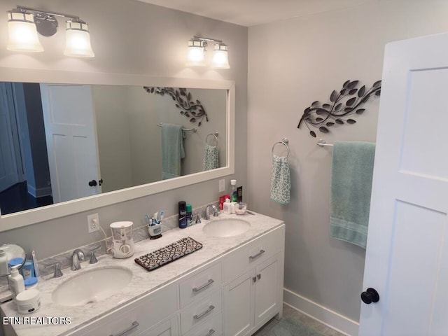 bathroom featuring tile patterned floors and vanity