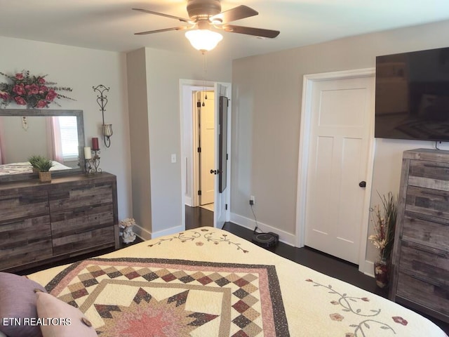 bedroom featuring ceiling fan and dark hardwood / wood-style floors