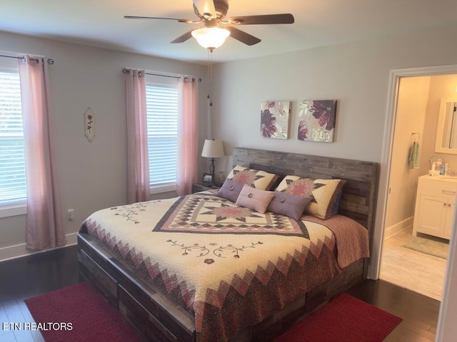 bedroom with multiple windows, ceiling fan, and dark hardwood / wood-style flooring