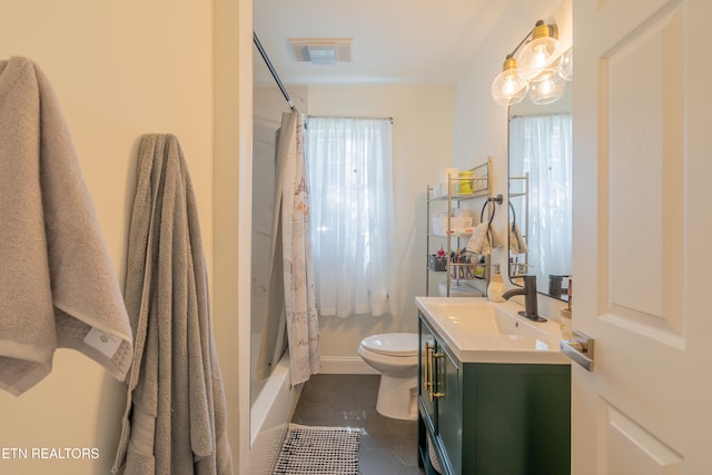 full bathroom featuring tile patterned floors, toilet, shower / bathtub combination with curtain, and a wealth of natural light