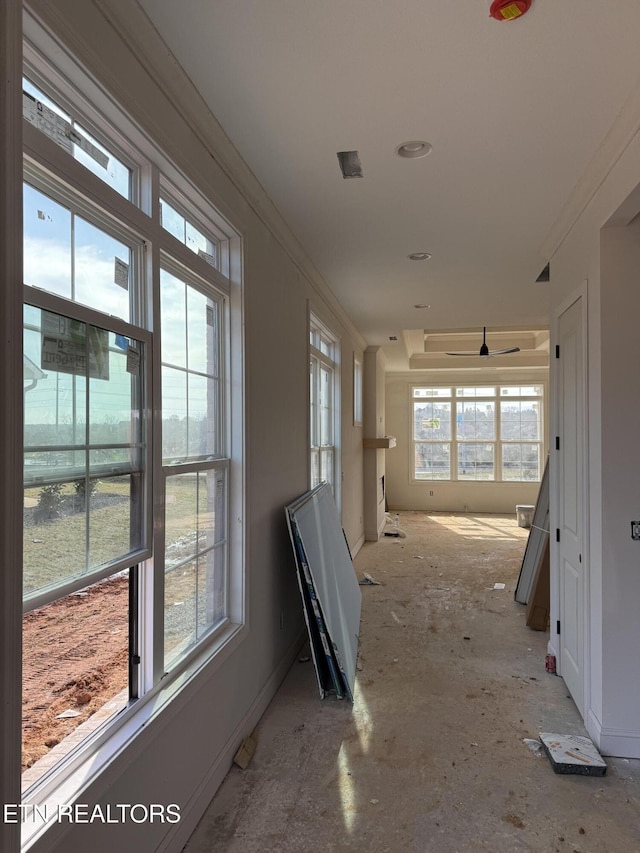 hallway featuring ornamental molding