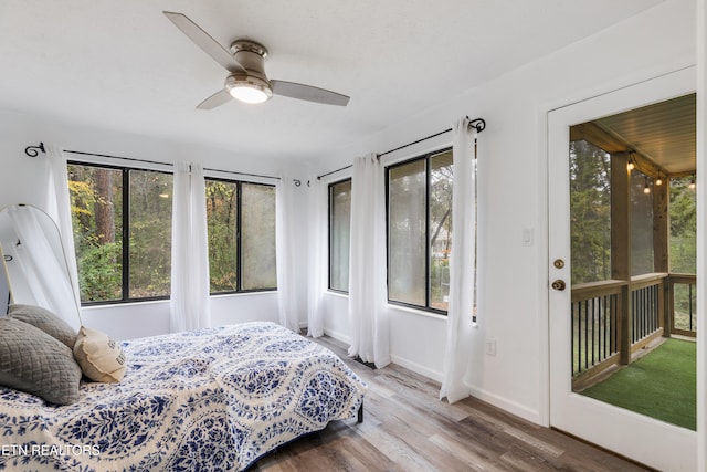 bedroom featuring hardwood / wood-style flooring and ceiling fan