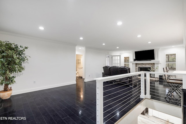 living room featuring hardwood / wood-style flooring and ornamental molding