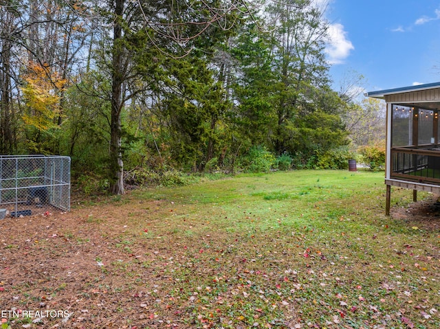 view of yard with a sunroom