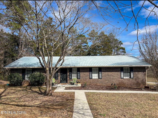 ranch-style home with a front yard