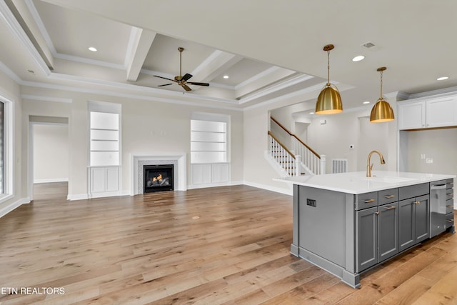 12033 Deer Crossing Dr, Knoxville, TN 37932 - kitchen featuring gray cabinetry, ceiling fan, open floor plan, light countertops, and ornamental molding