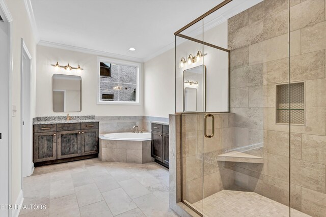 bathroom featuring separate shower and tub, vanity, and ornamental molding