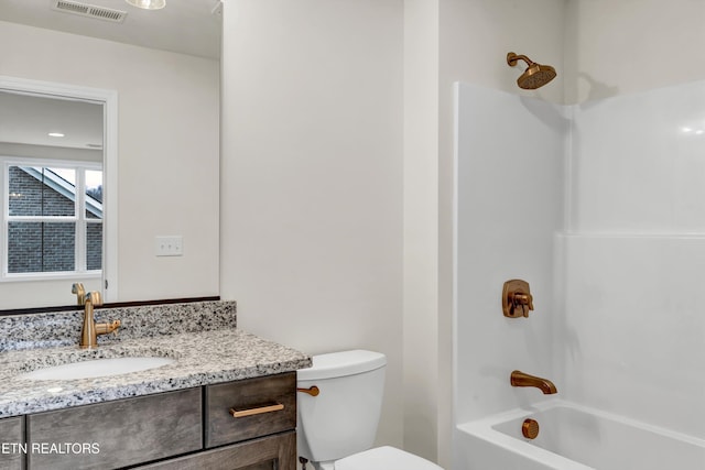 full bathroom with vanity, toilet, and bathtub / shower combination