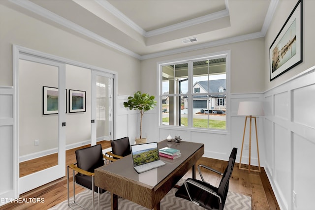 12033 Deer Crossing Dr, Knoxville, TN 37932 - home office featuring wood finished floors, a decorative wall, a raised ceiling, ornamental molding, and wainscoting