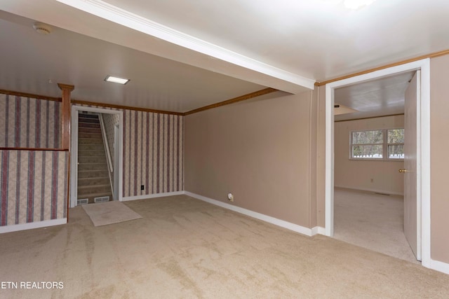 carpeted spare room featuring ornamental molding