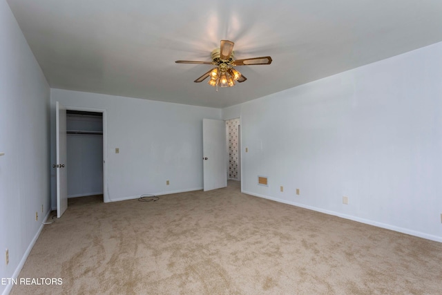 unfurnished bedroom with light carpet and ceiling fan