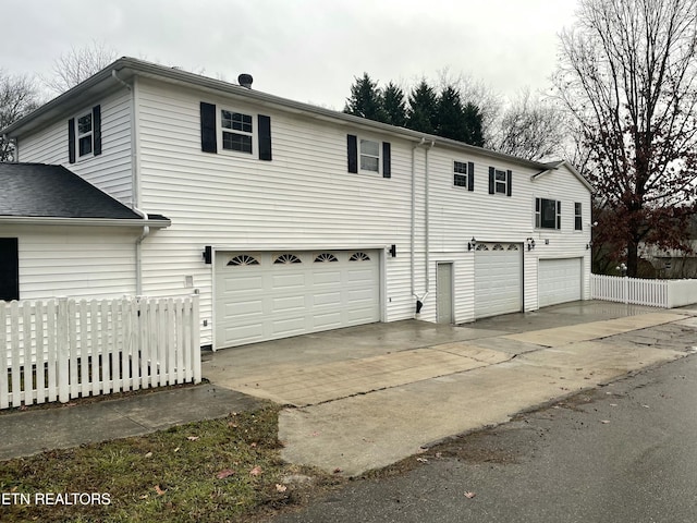 view of side of home with a garage