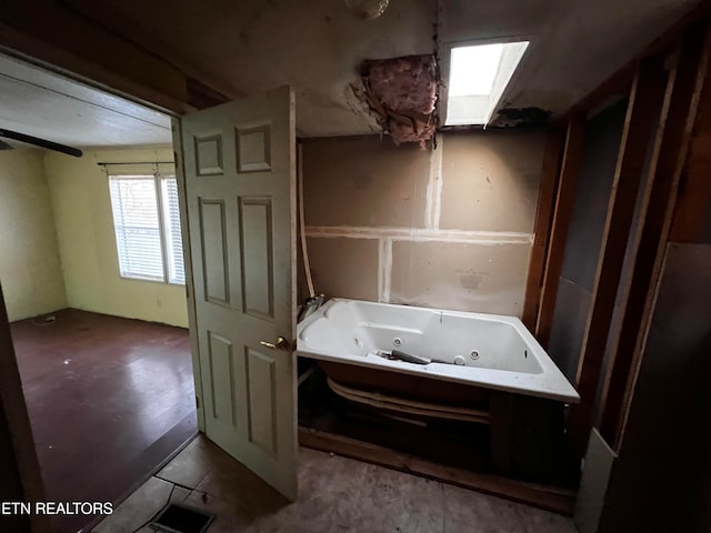 bathroom featuring a washtub