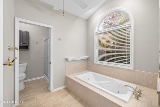 bathroom with toilet, hardwood / wood-style floors, vaulted ceiling, and plus walk in shower