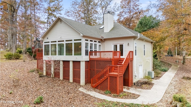 rear view of house with central AC, a sunroom, and a deck