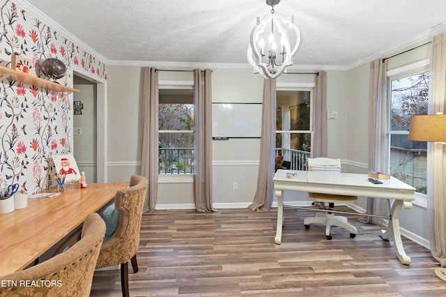 home office featuring wood finished floors, baseboards, an inviting chandelier, ornamental molding, and a textured ceiling