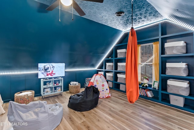 game room featuring a ceiling fan and wood finished floors