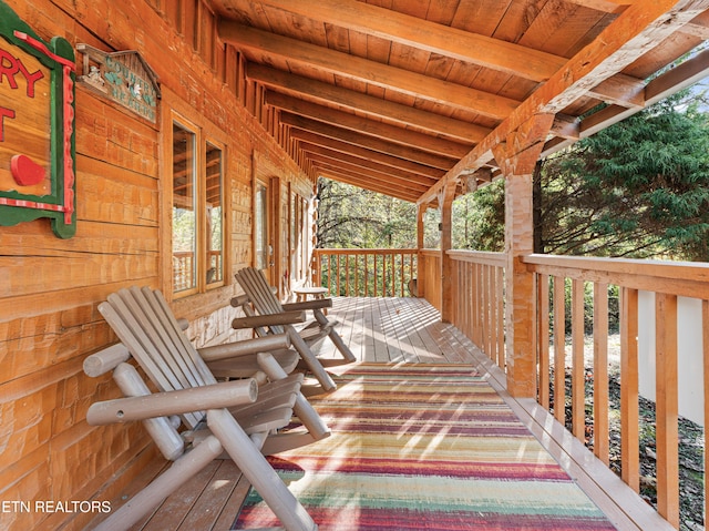 wooden terrace with a porch