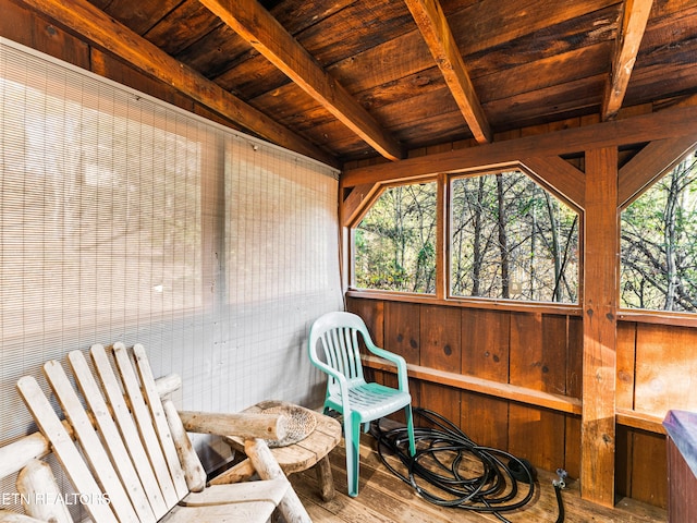 sunroom with beamed ceiling and wooden ceiling