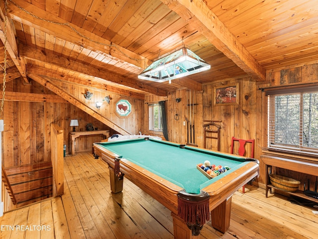 rec room featuring light hardwood / wood-style flooring, a wealth of natural light, wooden walls, and billiards